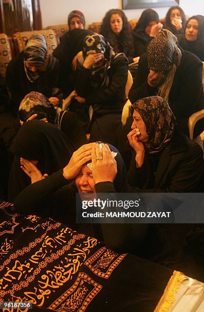 Lebanese women mourn over the coffin of businessman Hassan Tajeddine, who is one of the victims found at the crash site of the Ethiopian airliner,...