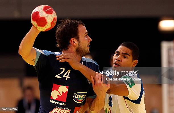 Uros Zorman of Slovenia in action with Daniel Narcisse of France during the Men's Handball European main round Group II match between Slovenia and...