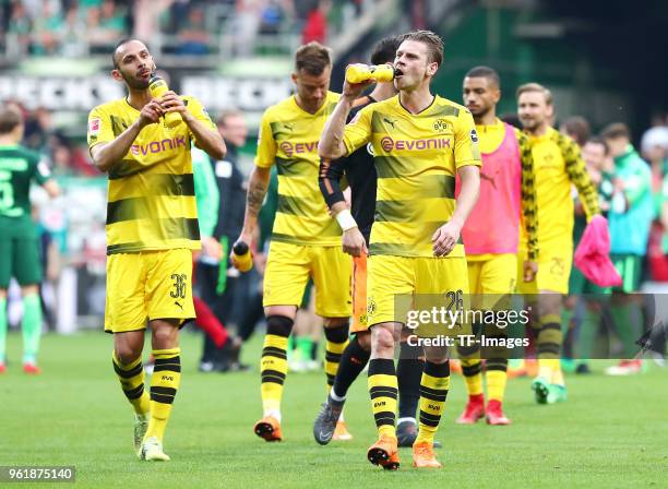 Oemer Toprak of Dortmund, Andrey Yarmolenko of Dortmund and Lukasz Piszczek of Dortmund look dejected after the Bundesliga match between SV Werder...