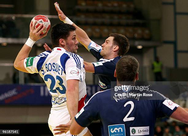 Luka Zvizej and Miladin Kozlina of Slovenia in action with Sebastein Bosquet of France during the Men's Handball European main round Group II match...