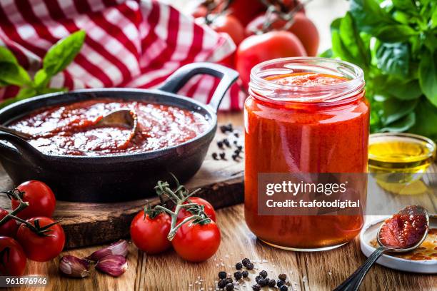 preparing tomato sauce - tomato sauce stock pictures, royalty-free photos & images