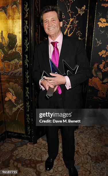 Melvyn Bragg poses with his Outstanding Achievement Award at the South Bank Show Awards, at The Dorchester on January 26, 2010 in London, England.