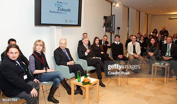 German President Horst Koehler and Israeli President Shimon Peres discus with youths at the Max-Liebermann-Haus on January 26, 2010 in Berlin,...