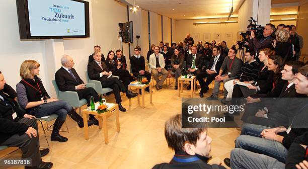 German President Horst Koehler and Israeli President Shimon Peres discus with youths at the Max-Liebermann-Haus on January 26, 2010 in Berlin,...