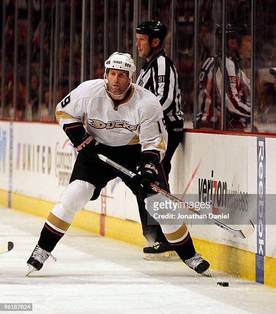 Ryan Whitney of the Anaheim Ducks looks to pass against the Chicago Blackhawks at the United Center on January 3, 2010 in Chicago, Illinois. The...