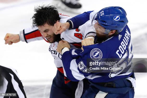 Braydon Coburn of the Tampa Bay Lightning fights with Tom Wilson of the Washington Capitals during the first period in Game Seven of the Eastern...