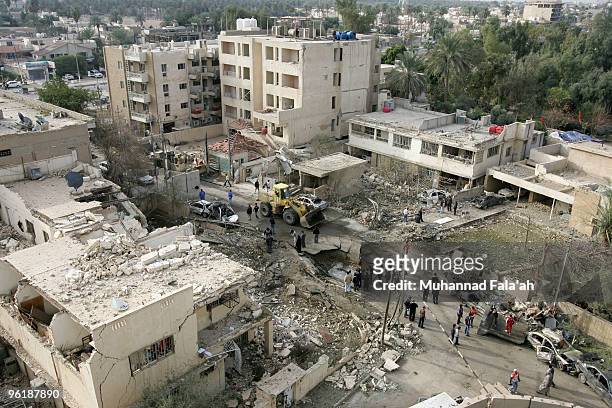 The site of a car bomb explosion is seen on January 26, 2010 near the Al-Hamra hotel in Baghdad, Iraq. Three car bombs exploded on January 25, 2010...