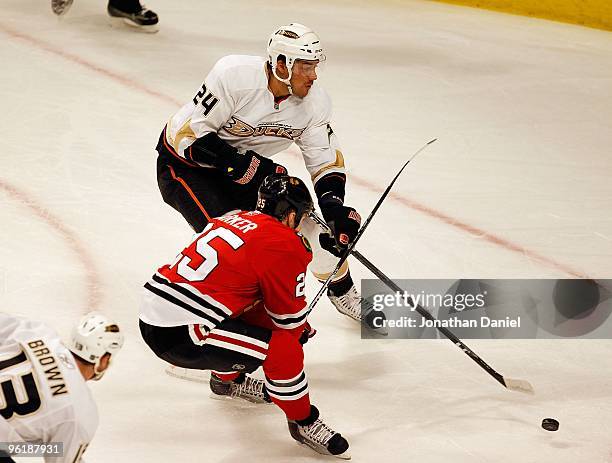 Evgeny Artyukhin of the Anaheim Ducks shoots the puck past Cameron Barker of the Chicago Blackhawks at the United Center on January 3, 2010 in...