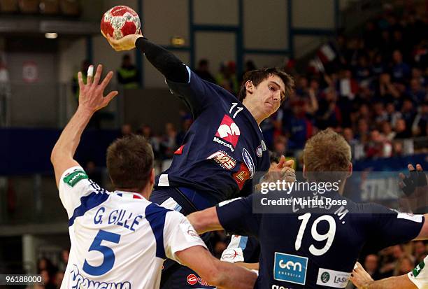 Sebastian Skube of Slovenia throws at goal during the Men's Handball European main round Group II match between Slovenia and France at the Olympia...