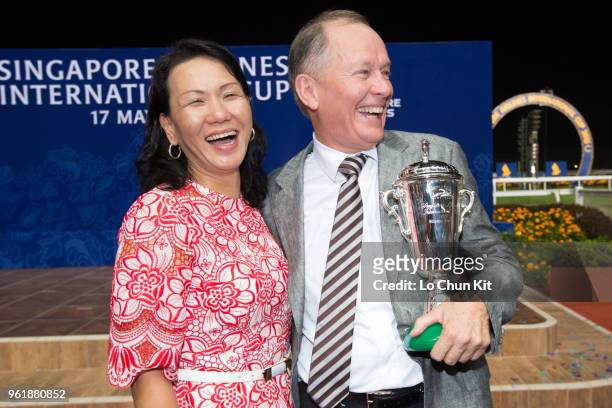 Trainer John Moore and his wife FiFi celebrate after Dan Excel winning the Singapore Airlines International Cup at Kranji Racecourse during the...