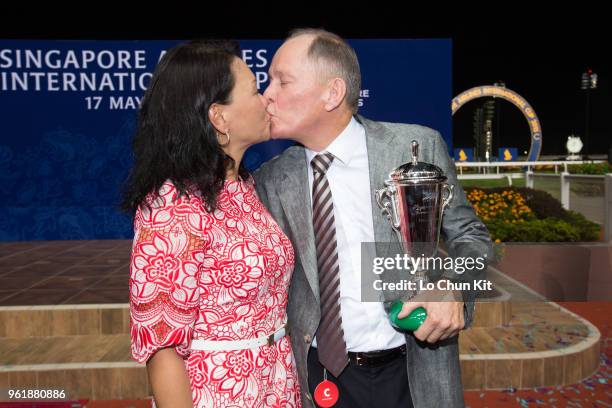 Trainer John Moore and his wife FiFi celebrate after Dan Excel winning the Singapore Airlines International Cup at Kranji Racecourse during the...