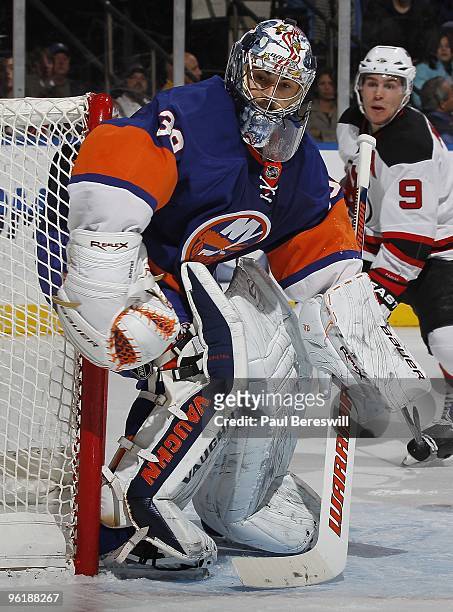 Goalie Rick DiPietro of the New York Islanders in action against the New Jersey Devils on January 23, 2010 at the Nassau Coliseum in Uniondale, New...