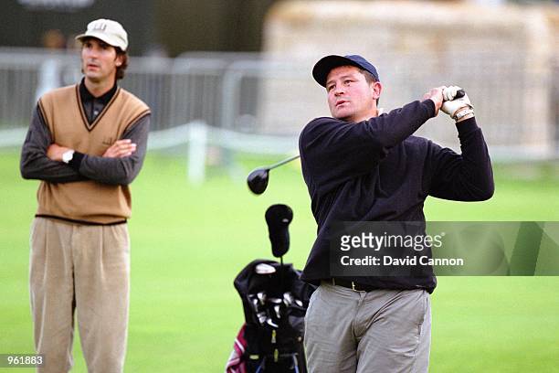 Zinzan Brooke of New Zealand is watched by golf coach Robert Baker at the Dunhill Links Championships held at Kingsbarns, Carnoustie, and St Andrews,...