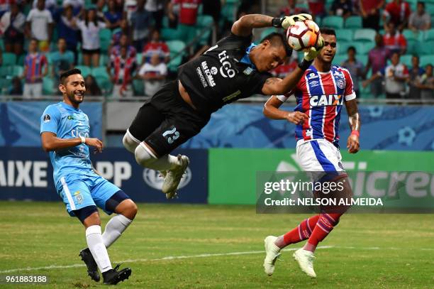 Bolivia's Blooming goalkeeper Hugo Suarez jumps to save the goal during their 2018 Copa Sudamericana football match held at Arena Fonte Nova stadium,...