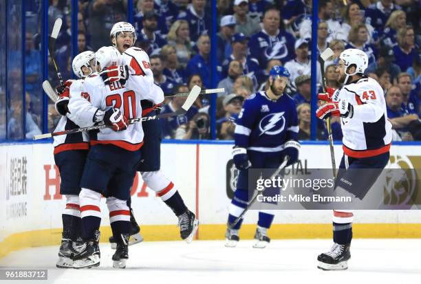 Andre Burakovsky of the Washington Capitals celebrates with his teammates Dmitry Orlov, Lars Eller and Tom Wilson of the Washington Capitals after...