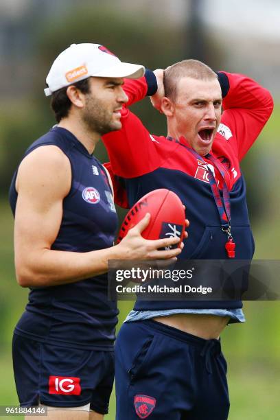 Demons head coach Simon Goodwin breaks into a yawn next to Jordan Lewis of the Demons during a Melbourne Demons AFL training session at Gosch's...