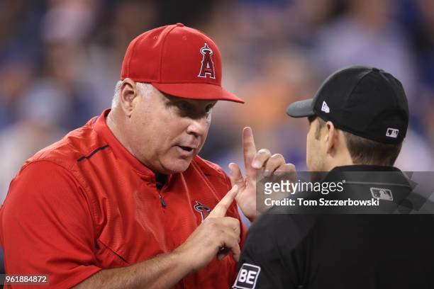 Manager Mike Scioscia of the Los Angeles Angels of Anaheim argues a call with home plate umpire Mark Wegner in the sixth inning during MLB game...