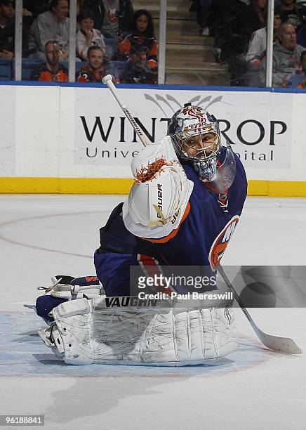 Goalie Rick DiPietro of the New York Islanders in action against the New Jersey Devils on January 23, 2010 at the Nassau Coliseum in Uniondale, New...