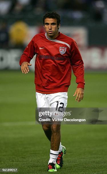 Jonathan Bornstein of USA stretches his legs during warm-up prior to their international friendly match against Honduras on January 23, 2010 in...