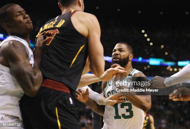 Marcus Morris and Terry Rozier of the Boston Celtics get into an altercation with Larry Nance Jr. #22 of the Cleveland Cavaliers in the first half...