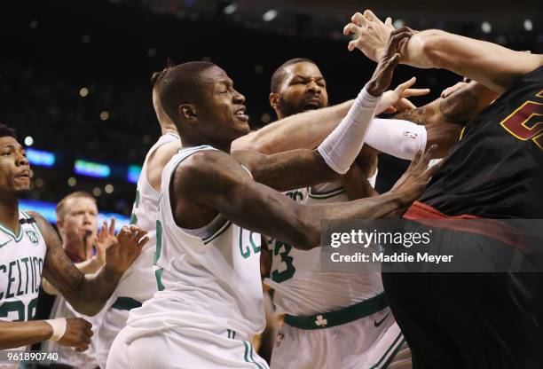 Marcus Morris and Terry Rozier of the Boston Celtics get into an altercation with Larry Nance Jr. #22 of the Cleveland Cavaliers in the first half...