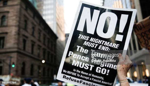 People stage a protest against U.S. President Donald Trump, outside the Lotte New York Palace Hotel on May 23, 2018 in New York, United States.