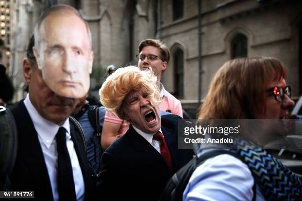 People stage a protest against U.S. President Donald Trump, outside the Lotte New York Palace Hotel on May 23, 2018 in New York, United States.