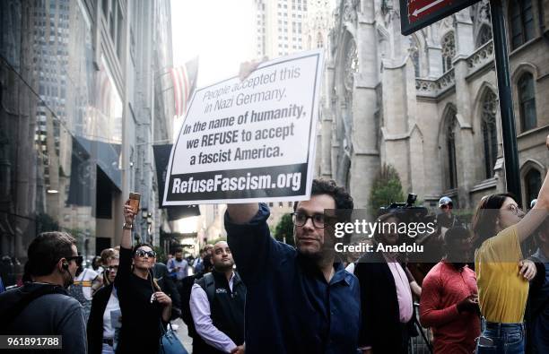 People stage a protest against U.S. President Donald Trump, outside the Lotte New York Palace Hotel on May 23, 2018 in New York, United States.