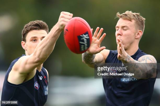 Jake Lever of the Demons and James Harmes compete for the ball during a Melbourne Demons AFL training session at Gosch's Paddock on May 24, 2018 in...