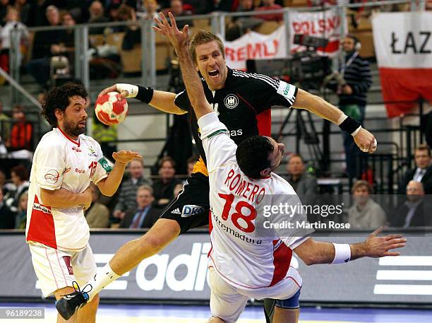 Lars Kaufmann of Germany in action with Iker Romero of Spain during the Men's Handball European main round Group II match between Germany and Spain...