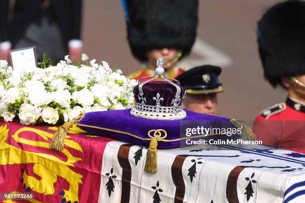 The coffin carrying the Queen Mother departs from St. James Palace, followed by members of the Royal Family.