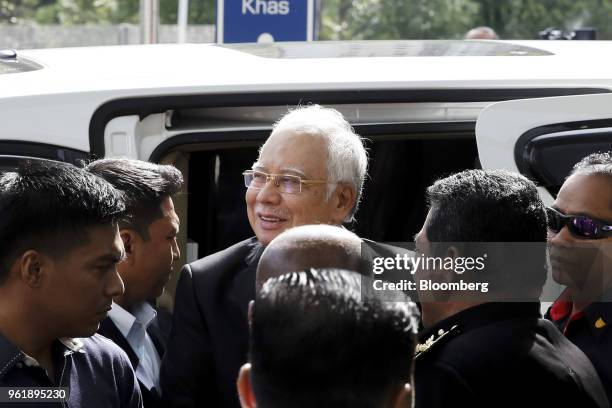 Najib Razak, Malaysia's former prime minister, center, arrives at the Malaysian Anti-Corruption Commission headquarters in Putrajaya, Malaysia, on...