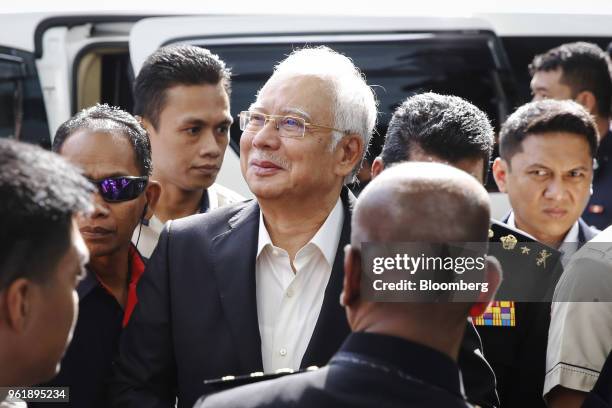 Najib Razak, Malaysia's former prime minister, center, arrives at the Malaysian Anti-Corruption Commission headquarters in Putrajaya, Malaysia, on...