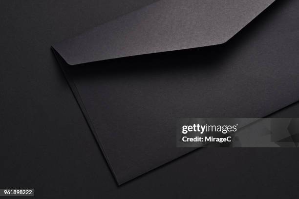 opening black envelope - envelope stock pictures, royalty-free photos & images