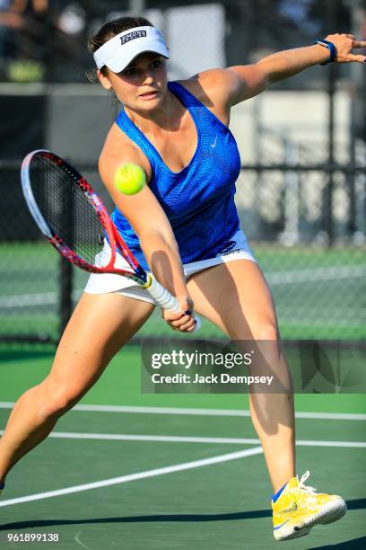 Bridget Harding of the Emory Eagles returns a ball against Catherine Allen of the Claremont-Mudd-Scripps Athenas during the Division III Women's...