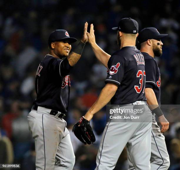 Jose Ramirez of the Cleveland Indians and Cody Allen celebrate their win over the Chicago Cubs at Wrigley Field on May 23, 2018 in Chicago, Illinois....