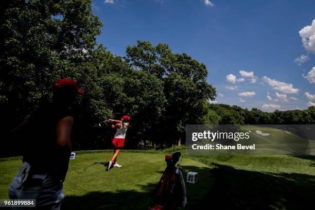 Kristen Gillman of Alabama tees off as Gigi Stoll of Arizona watches during the Division I Women's Golf Team Match Play Championship held at the...