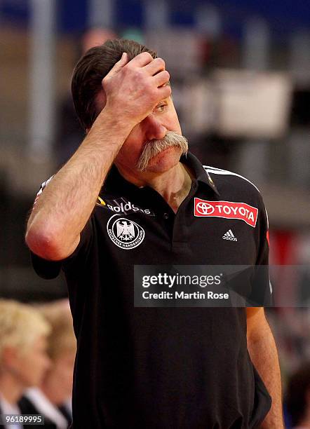 Heiner Brand, head coach of Germany looks dejected during the Men's Handball European main round Group II match between Germany and Spain at the...