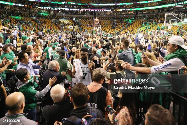 Jaylen Brown of the Boston Celtics high fives fans after defeating the Cleveland Cavaliers 96-83 in Game Five of the 2018 NBA Eastern Conference...