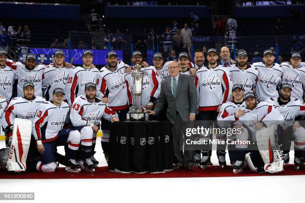 The Washington Capitals and NHL Deputy Commissioner Bill Daly pose with the Prince of Wales Trophy after defeating the Tampa Bay Lightning in Game...