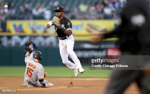 Chicago White Sox shortstop Tim Anderson throws to first base after forcing out Baltimore Orioles baserunner Chance Sisco at second base in the...
