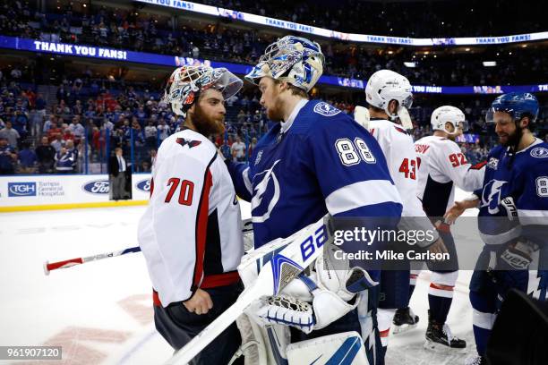 Braden Holtby of the Washington Capitals talks with Andrei Vasilevskiy of the Tampa Bay Lightning after Game Seven of the Eastern Conference Finals...