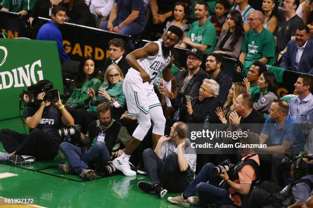 Jaylen Brown of the Boston Celtics falls into New England Patriots owner Robert Kraft during Game Five of the 2018 NBA Eastern Conference Finals...