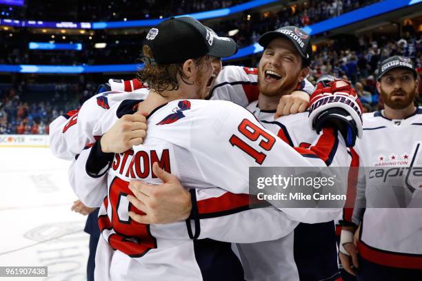 Nicklas Backstrom of the Washington Capitals celebrates with his teammates after defeating the Tampa Bay Lightning in Game Seven of the Eastern...
