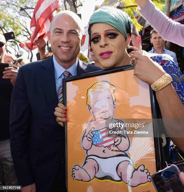 Pop artist Sham Ibrahim presents adult film star Stormy Daniels' attorney Michael Avenatti with artwork of Donald Trump at a ceremony as Stormy...