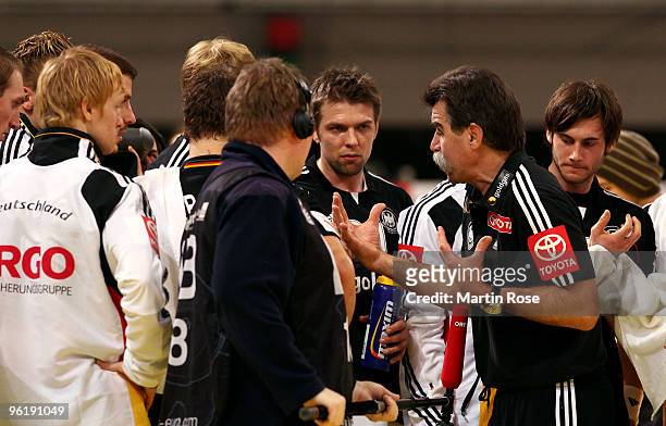 Heiner Brand , head coach of Germany gives instructions during the Men's Handball European main round Group II match between Germany and Spain at the...