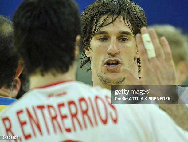 Spanish Viran Morros de Argila celebrates their victory against Germany with his teammate Raul Entrerrios in the Olympic Hall of Innsbruck on January...