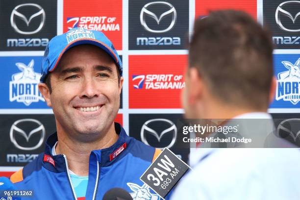 Kangaroos head coach Brad Scott reacts to television reporter during the North Melbourne Kangaroos AFL training session at Arden Street Ground on May...