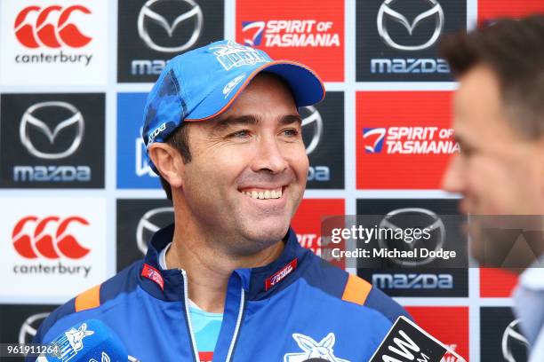 Kangaroos head coach Brad Scott reacts to television reporter during the North Melbourne Kangaroos AFL training session at Arden Street Ground on May...