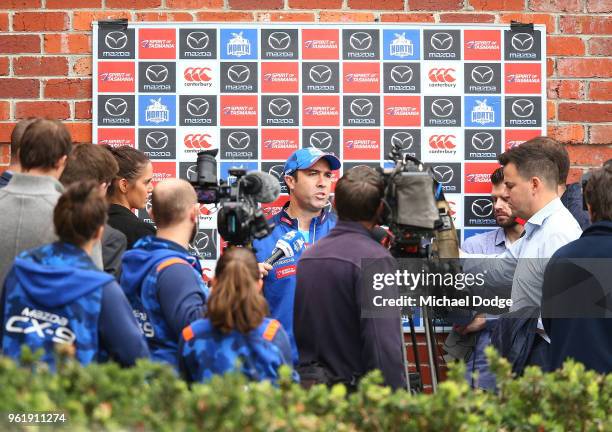 Kangaroos head coach Brad Scott speaks to media during the North Melbourne Kangaroos AFL training session at Arden Street Ground on May 24, 2018 in...